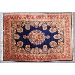 A GOOD LARGE PERSIAN CARPET, deep blue ground, with all-over stylised floral decoration