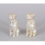 A SMALL PAIR OF DOG SALT AND PEPPERS. 5cms high.