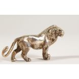 A CAST SILVER MODEL OF A LION. 7cms long. Stamped .925. Maker: GM & RH.