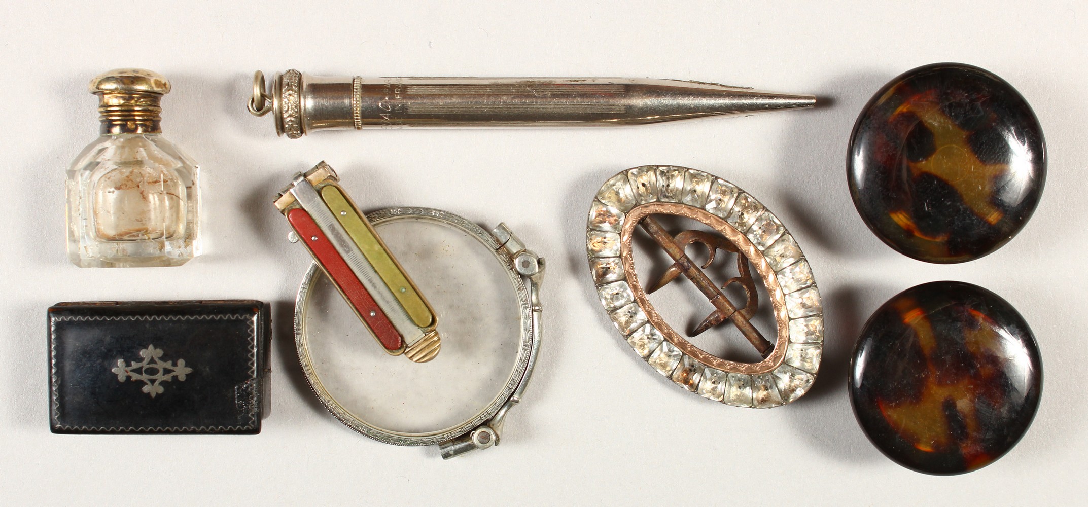 A SMALL SCENT BOTTLE, SNUFF BOX, two tortoiseshell boxes, lorgnette, brooch and pencil.
