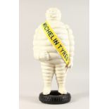 A LARGE PAINTED CAST IRON MICHELIN MAN. 21ins high.