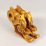 A PAIR OF CARVED AND GILDED WOOD BRACKETS. 16ins long.