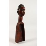 A CARVED WOOD TRIBAL SCOOP, head of a woman. 11ins long.