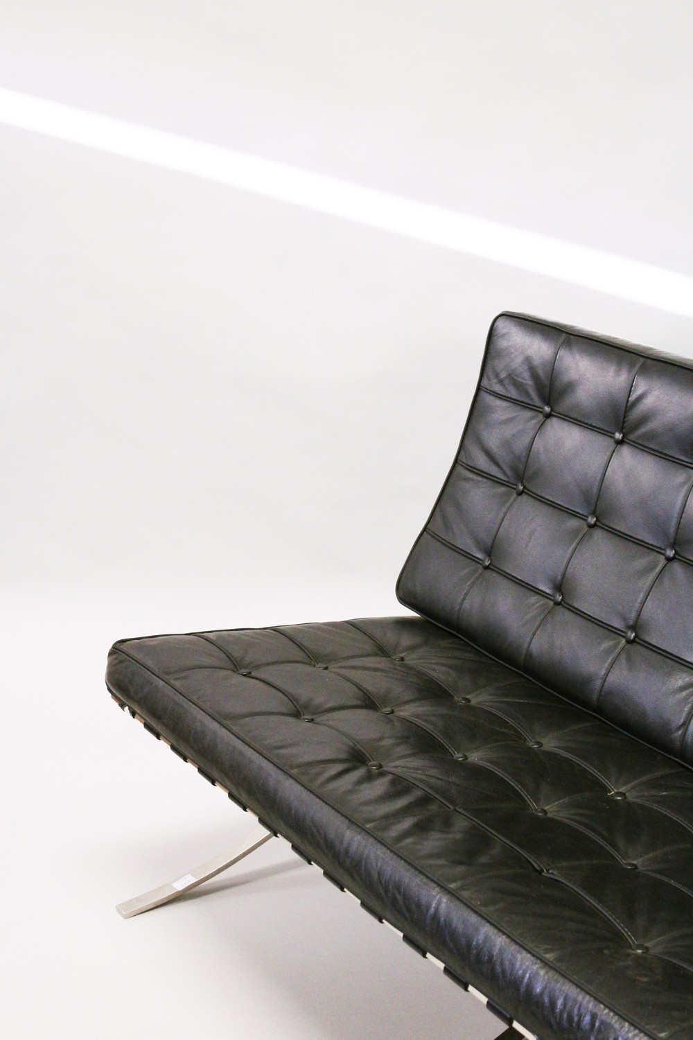 MIES VAN DER ROHE, A BARCELONA SETTEE, with button upholstered black leather back and seat cushions, - Image 2 of 5