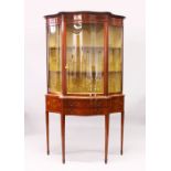 AN EDWARDIAN MAHOGANY AND MARQUETRY CABINET ON STAND, of serpentine outline, with an inlaid
