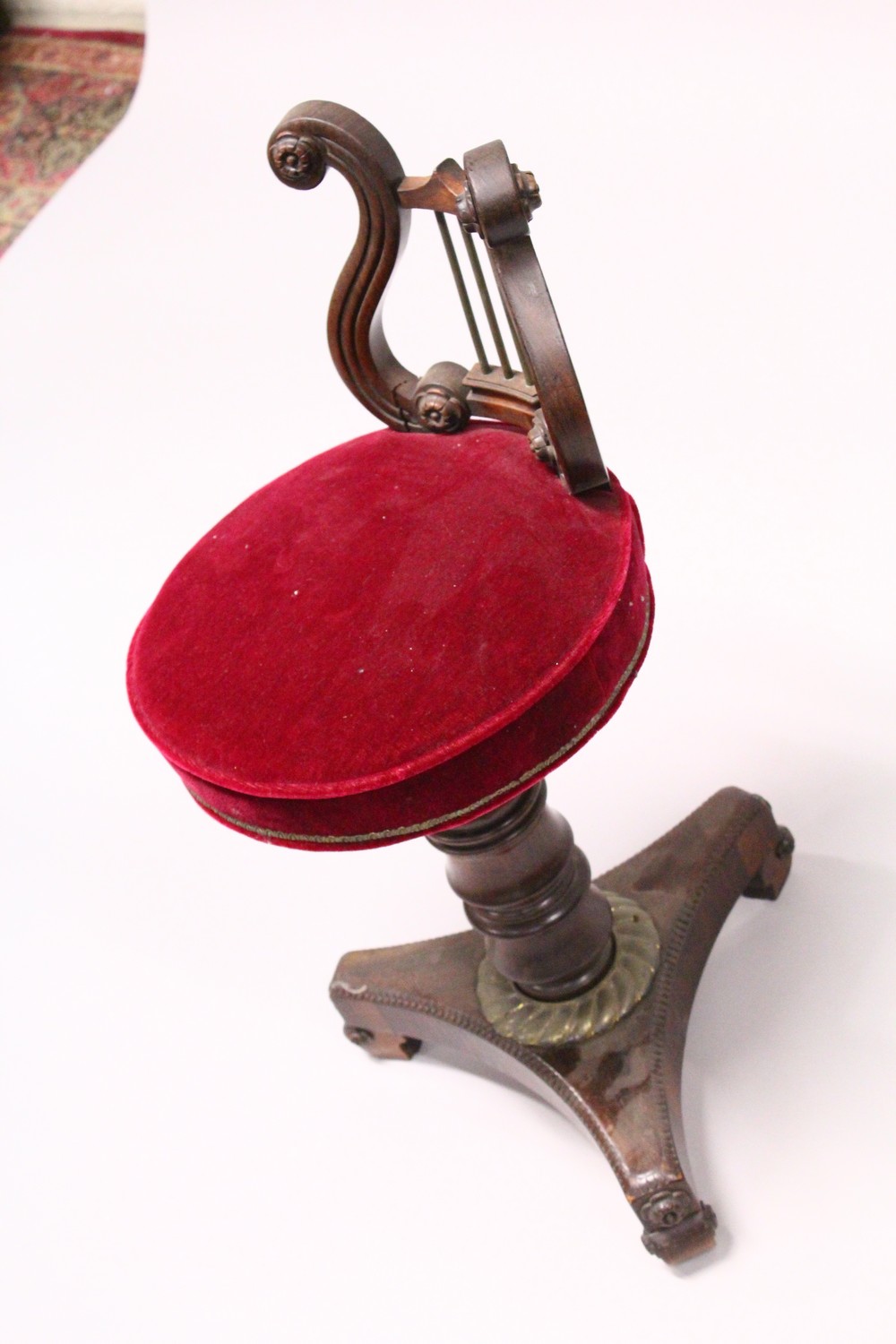 A 19TH CENTURY ROSEWOOD REVOLVING MUSIC SEAT, with lyre shaped back, overstuffed seat on a turned - Image 2 of 2