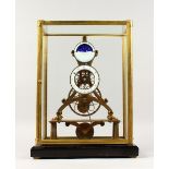 A MOON PHASE SKELETON CLOCK in a glass case. 17.5ins high including case.