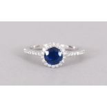 AN 18CT WHITE GOLD SAPPHIRE AND DIAMOND HALO STYLE RINGof 1.5cts approx.