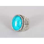 a SILVER AND TURQUOISE RING.