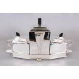 A CHRISTOPHER DRESSER DESIGN ART DECO THREE PIECE TEA SET, in a stand with carrying handle.