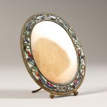 AN ITALIAN GILT METAL AND ENAMEL OVAL PHOTOGRAPH FRAME. 8cms x 6cms.