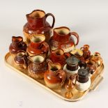 A COLLECTION OF FIFTEEN SALT GLAZED STONEWARE JUGS, by DOULTON, STIFF & SONS, and other makes.