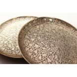 TWO SMALL PERSIAN SILVER CIRCULAR DISHES. 3ins diameter.