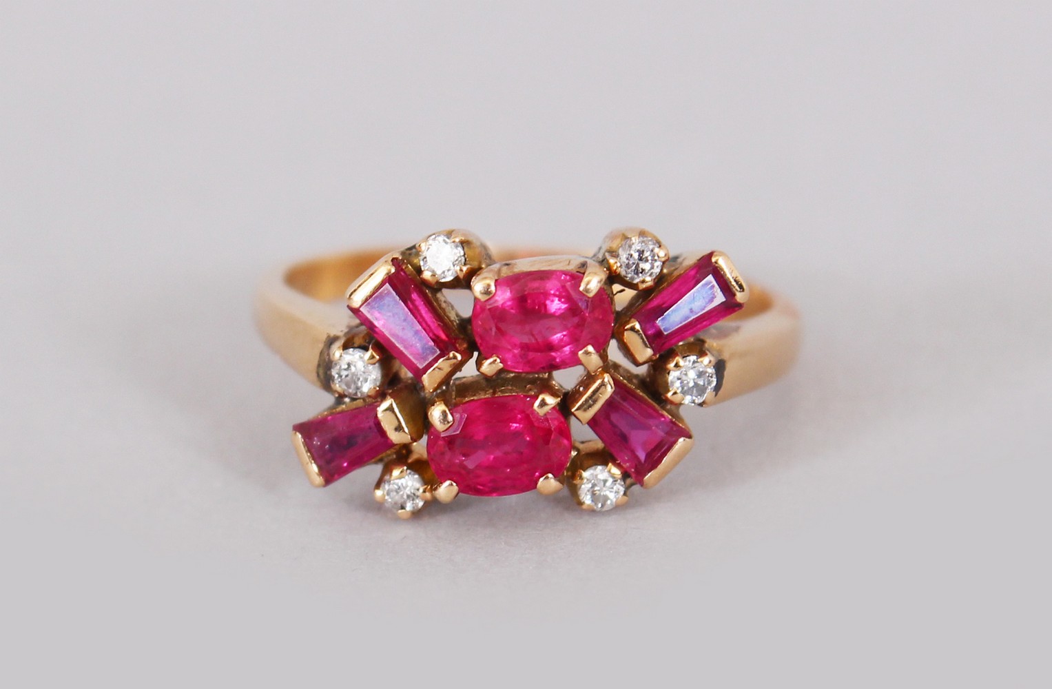 A YELLOW GOLD RUBY AND DIAMOND RING.