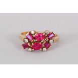 A YELLOW GOLD RUBY AND DIAMOND RING.