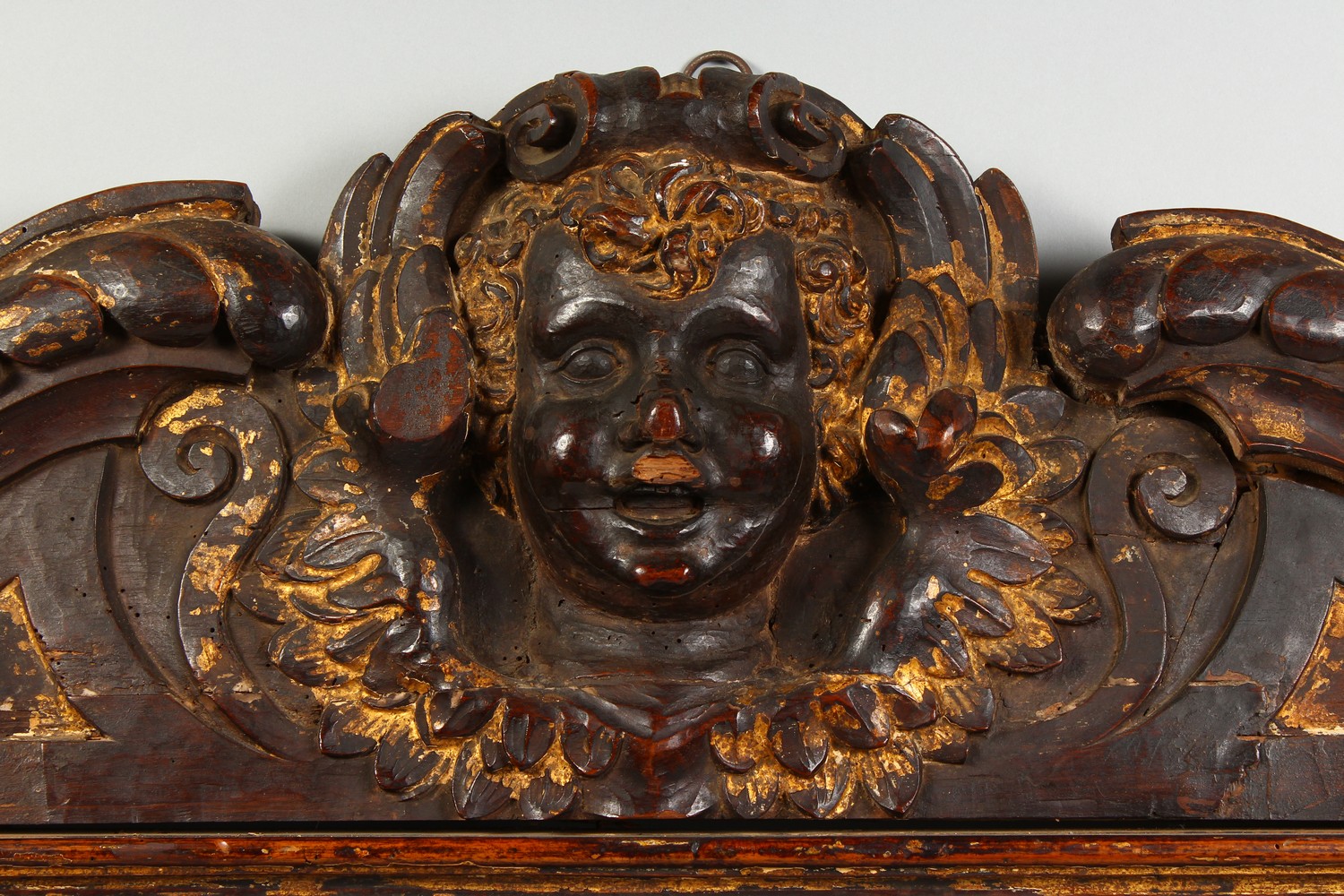 A 17TH-18TH CENTURY ITALIAN CARVED WOOD AND GILDED HEADBOARD carved with a mask. 45ins long x - Image 2 of 2