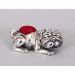 A NOVELTY SILVER PUG DOG PIN CUSHION.