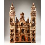 A SUPERB VERY LARGE PERUVIAN PAINTED POTTERY CATHEDRAL, with two bell towers, two clocks and