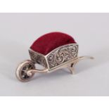 A NOVELTY SILVER WHEELBARROW PIN CUSHION.