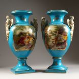 A PAIR OF SEVRES DESIGN BLUE TAPERING TWO HANDLED VASES, with angel head handles with reverse panels