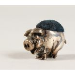 A TINY SILVER PIG PIN CUSHION. 1.75cms long. London 1933.