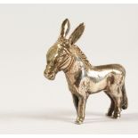 A CAST SILVER MODEL OF A DONKEY. 4.5cms long. Stamped .925.