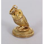 A GOLD PLATED OWL SEAL.