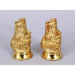 A GOOD PAIR OF GOLD PLATED DOG SALT AND PEPPERS.