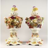 A GOOD PAIR OF MEISSEN POTTERY FLOWER ENCRUSTED VASES, COVERS AND STANDS with reverse panels of