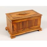 AN OLIVE WOOD JEWELLERY CASKET, with silk lining, on bracket feet. 8.5ins long.