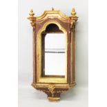 AN 18TH CENTURY ITALIAN CARVED WOOD, PAINTED AND GILDED SHRINE CABINET with mirrored back. 4ft