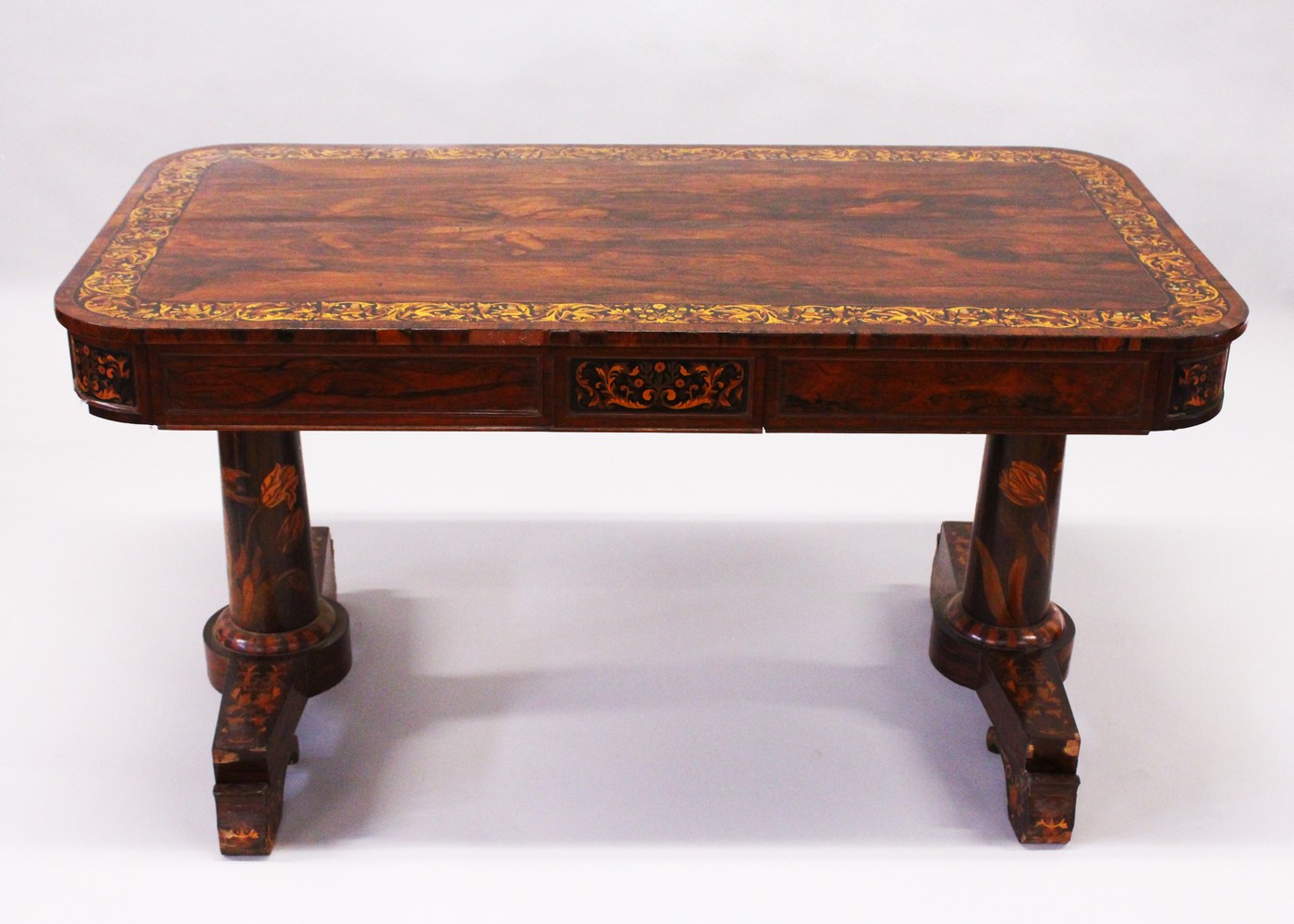AN EARLY 19TH CENTURY ROSEWOOD AND MARQUETRY LIBRARY TABLE, in the manner of Gillow, the rounded