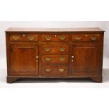 A GOOD 18TH CENTURY OAK DRESSER BASE, with plain top, the front with three frieze drawers over three