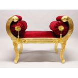 A GILDED WINDOW SEAT, with curved ends and red velvet cover, on shaped legs. 3ft 1ins long.