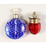 A SMALL VICTORIAN RUBY GLASS SILVER TOP SCENT BOTTLE and A BLUE SCENT BOTTLE.