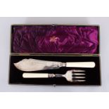 A VICTORIAN KNIFE AND FORK, with ivory handles, in a fitted case. Sheffield 1898. Maker: Martin Hall