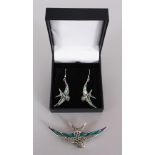 A SILVER AND ENAMEL SWALLOW BROOCH AND EARRINGS.