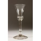 A PLAIN GEORGIAN WINE GLASS with inverted bell bowl. 6ins high.