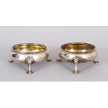 A PAIR OF GEORGE III CIRCULAR SALTS, on three pad feet. London 1766. Maker: W.I.