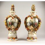 A SUPERB PAIR OF MEISSEN PATTERN TWO HANDLED URN SHAPED VASES, COVERS AND STANDS encrusted with