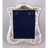 A LARGE SILVER DAFFODIL FRAME. 11.5ins x 9.5ins.