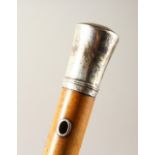 A 19TH CENTURY MALACCA WALKING CANE, with engraved silver top and lanyard holes. 35ins long.