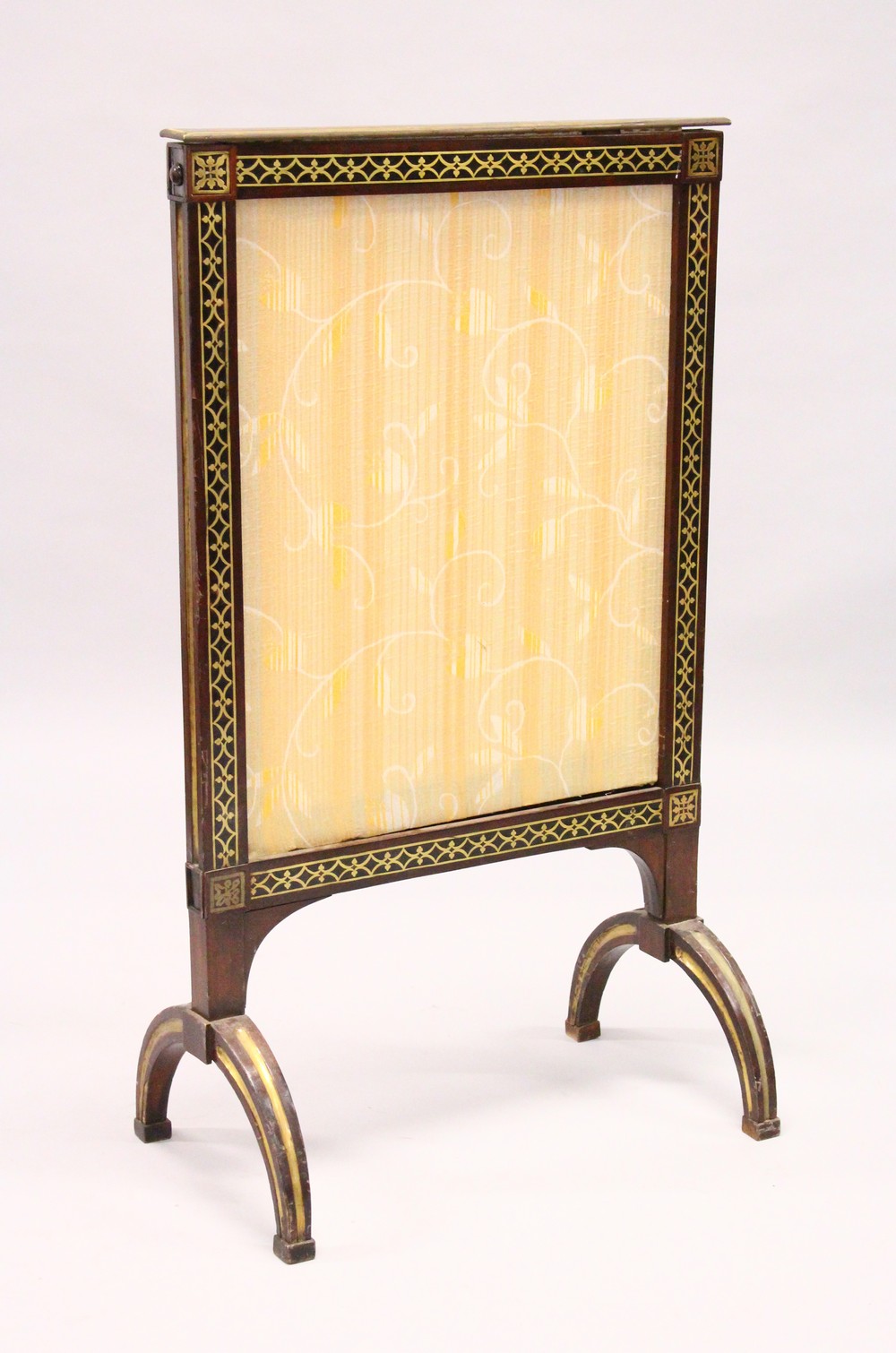 A REGENCY MAHOGANY AND BRASS INLAID FIRE SCREEN with upholstered panel on curving legs. 3ft 8.5ins