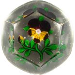 A 19TH CENTURY CUT GLASS PANSY PAPERWEIGHT, Possibly St Louis, with faceted sides and star cut base.