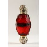 A DOUBLE ENDED RUBY SCENT BOTTLE, with silver top.