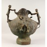 A LARGE BRONZE TWO HANDLED URN with cupid handles. 2ft high.
