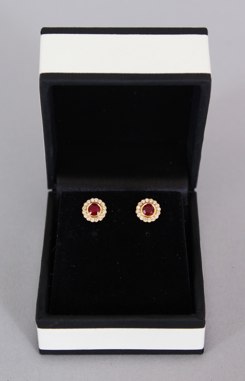A PAIR OF 18CT YELLOW GOLD RUBY AND DIAMOND EARRINGS.