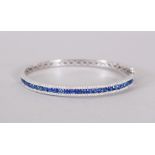 AN 18CT WHITE GOLD SAPPHIRE AND DIAMOND BANGLE of 2.5cts approx.