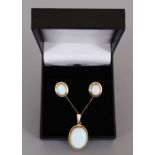 A 9CT GOLD GILSON OPAL PENDANT AND EARRINGS.