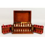 A GOOD VICTORIAN MAHOGANY GAMES COMPENDIUM, opens to reveal chess set, draughts, cards, cribbage,